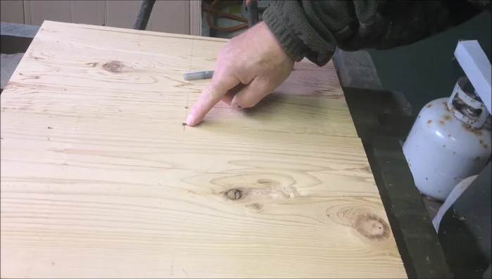 Place the nail in the center of the square base and use the jig to draw a circle.
