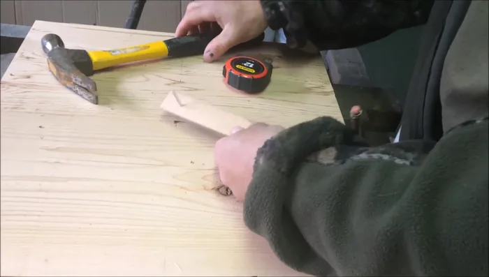 Place the nail in the center of the square base and use the jig to draw a circle.