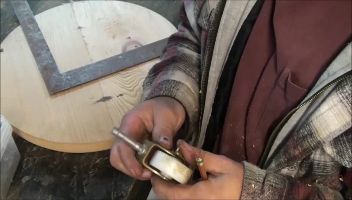 Attach the casters to the bottom of the pot dolly. Use high-quality casters with ball bearings for smooth rotation.