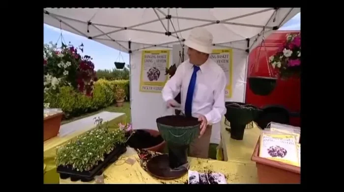 Firm the compost around the plants.