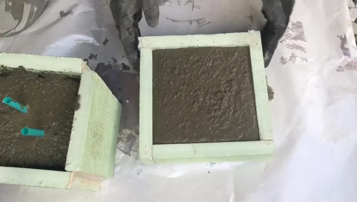 Add support to hold the molds together while the concrete sets.