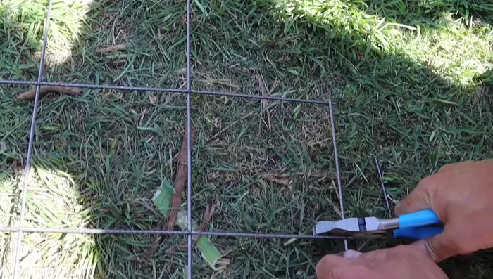 Push stakes into the ground to form an arch.