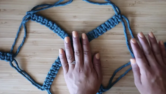 Place a pot (6-inch recommended, but 4-10 inch works) in the center of the square knots.