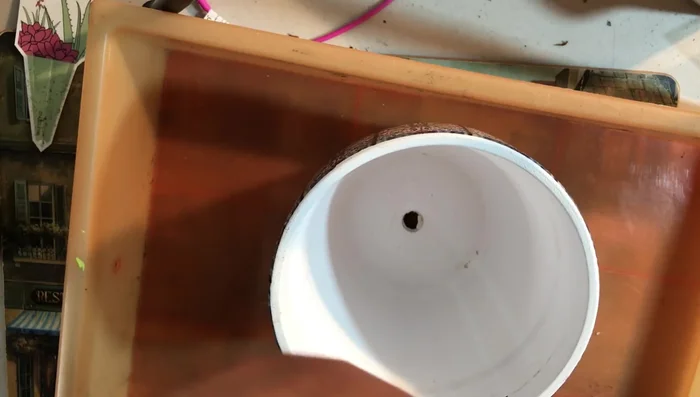 Add drainage screen to the bottom of the new pot