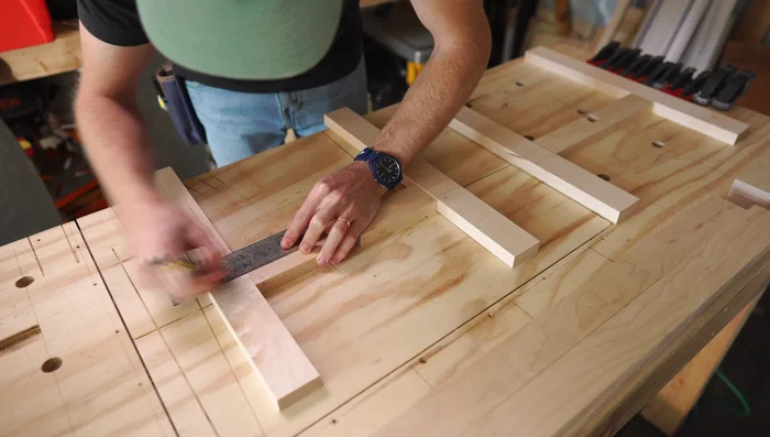 Create mortise and tenon joints: Mark reference lines for cutting joinery between legs and cross pieces. Use the Beadlock Basic Loose Tenon Kit to drill out the mortises and tenons.