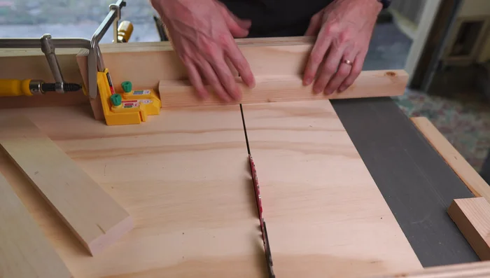 Create half-lap joints: Make two cuts to establish the outside edges of each notch, using the Micro Jig Matchfit Dado Stop on a crosscut sled. Make further cuts to remove the rest of the material.