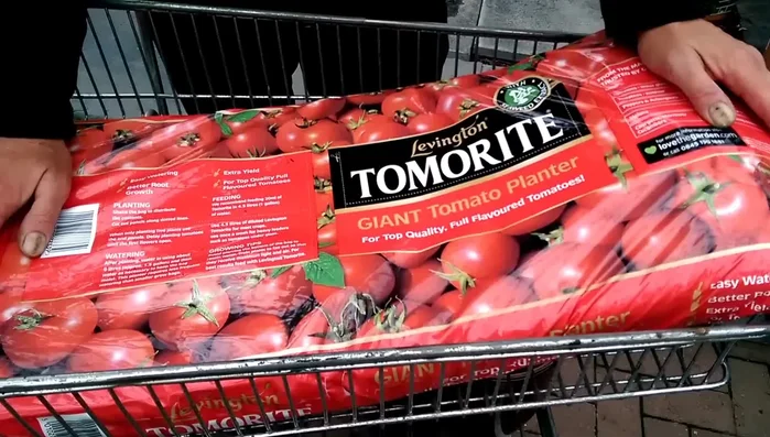 Prepare the grow bag: Place the grow bag on a level surface. Puncture holes in the bottom for drainage. (Ensure drainage is sufficient).