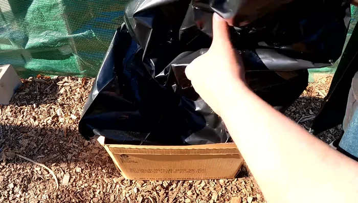 Tape the bag securely to the box using Gorilla tape (optional: clean with isopropyl alcohol for better adhesion).