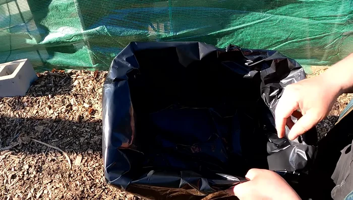 Tape the bag securely to the box using Gorilla tape (optional: clean with isopropyl alcohol for better adhesion).