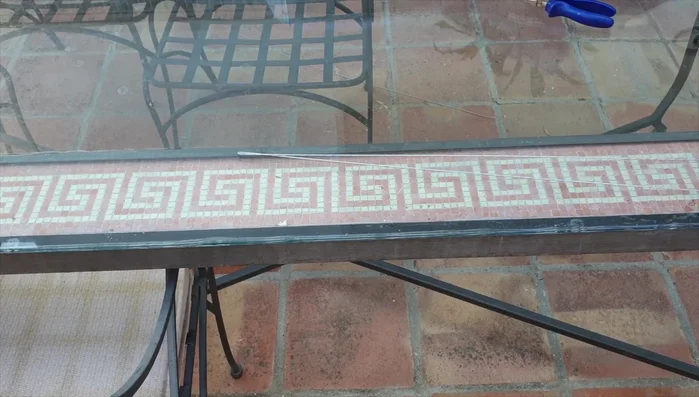 Slide a section of the plastic cable organizer onto the wire to protect the orchid roots from the wire and prevent rust.