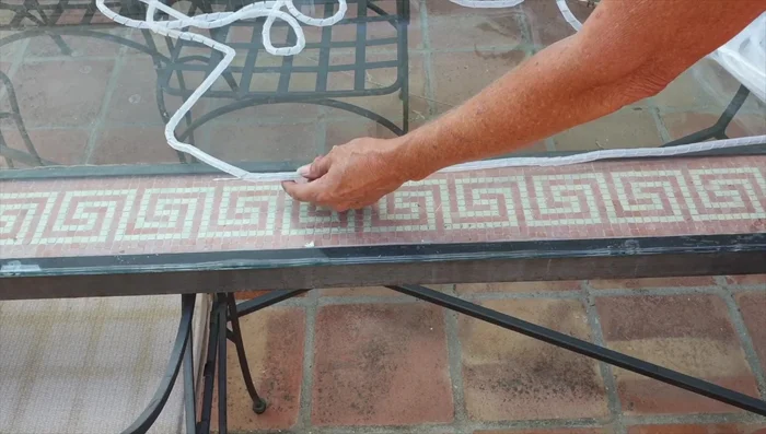Create a hook at the top of the wire by bending it. Secure the ends of the wire with duct tape.