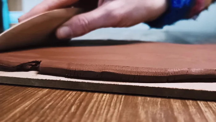 Smooth out any inconsistencies on the surface of the rolled clay.