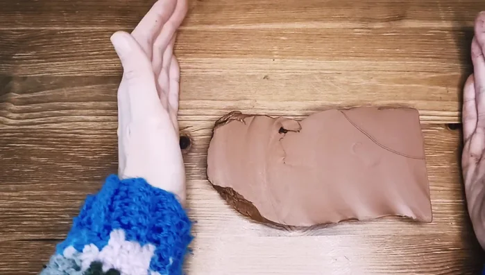 Smooth out any inconsistencies on the surface of the rolled clay.