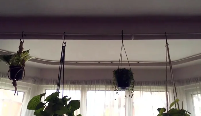 Install a curtain rod.