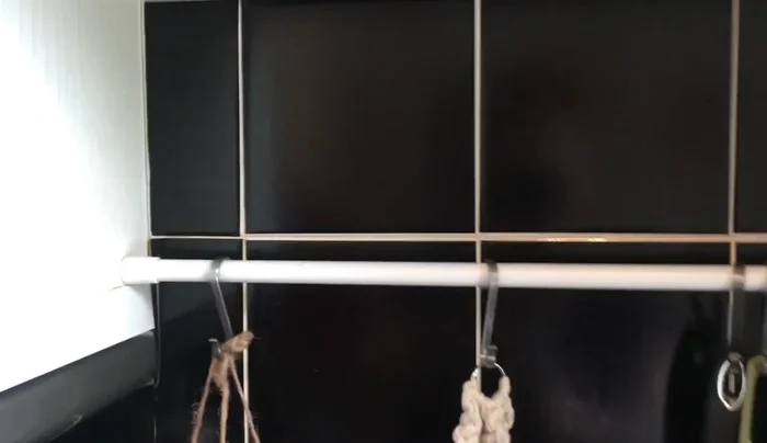 Install a tension rod between two surfaces.