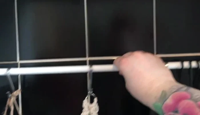 Hang plants from the tension rod using S hooks or other suitable hangers.