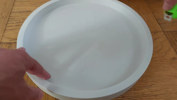 Select a caddy slightly larger than your pot's inside diameter to accommodate the curve of the pot and ensure a snug fit.