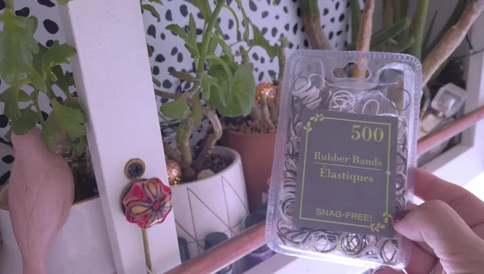 Secure pots to structures using small rubber bands and hooks, ensuring a snug fit to prevent movement during bumpy rides.