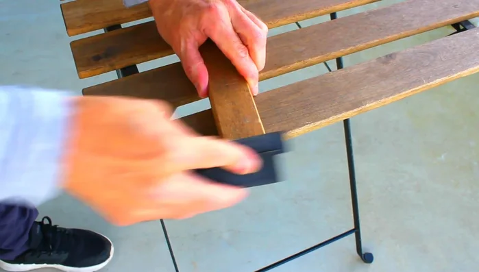 Sand the ends of the wood pieces to smooth them out.