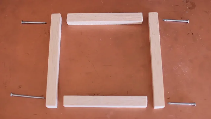 For the final corner, use wood glue and pressure to align the pieces before nailing.
