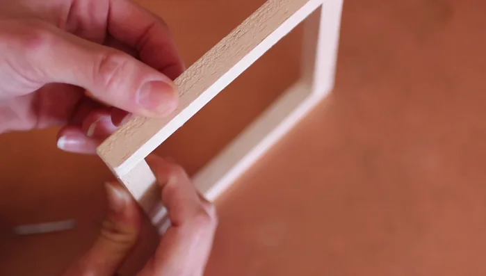 For the final corner, use wood glue and pressure to align the pieces before nailing.