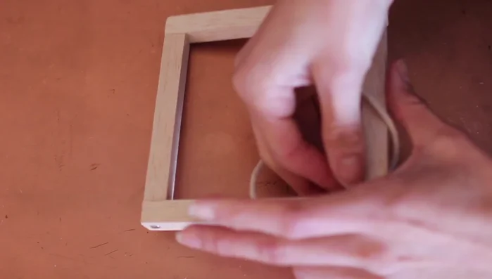 Tie a knot at the top of all the cords.